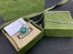 Gucci pendant necklace with green round medallion on silver chain in box
