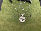 Silver-tone necklace with round interlocking G pendant and beaded double-layer chain