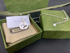 Silver-tone logo pendant necklace with beaded chain and round interlocking G charm