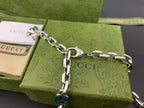 Silver chain strap with blue interlocking G charm and ring clasp