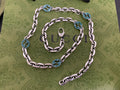 Silver chain strap with blue interlocking G medallions and rings