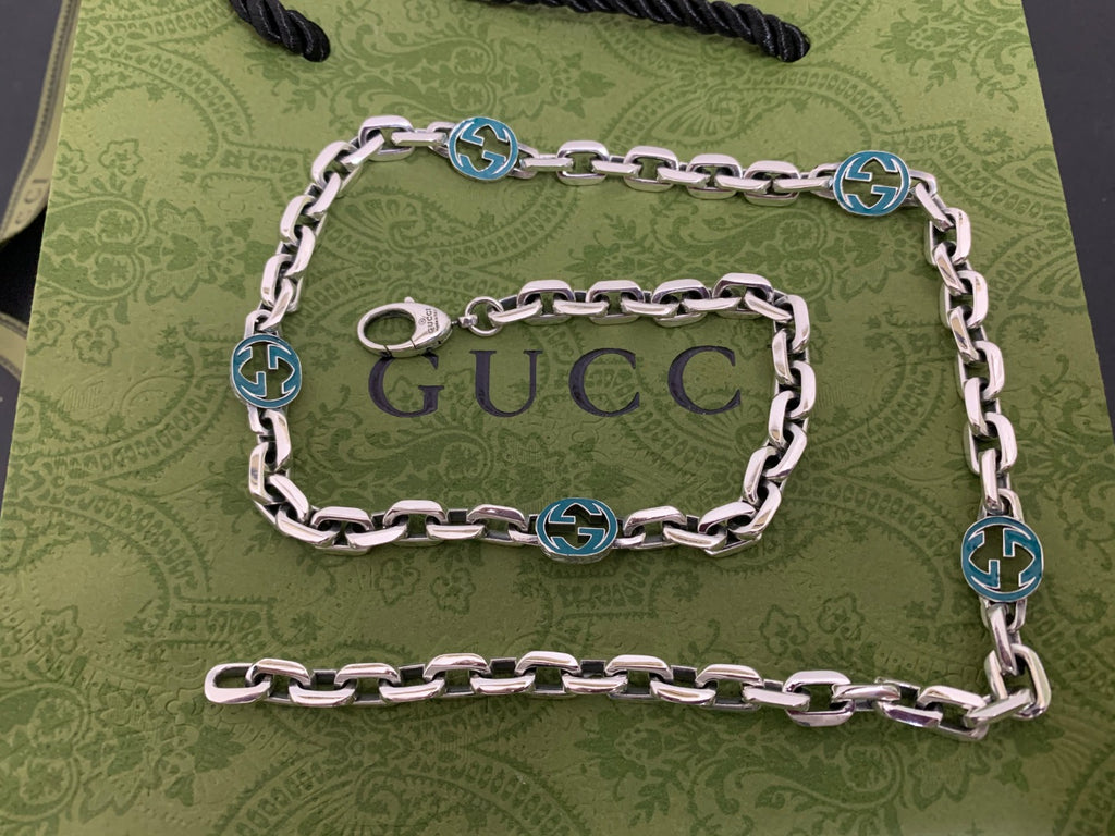Silver chain strap with blue interlocking G links