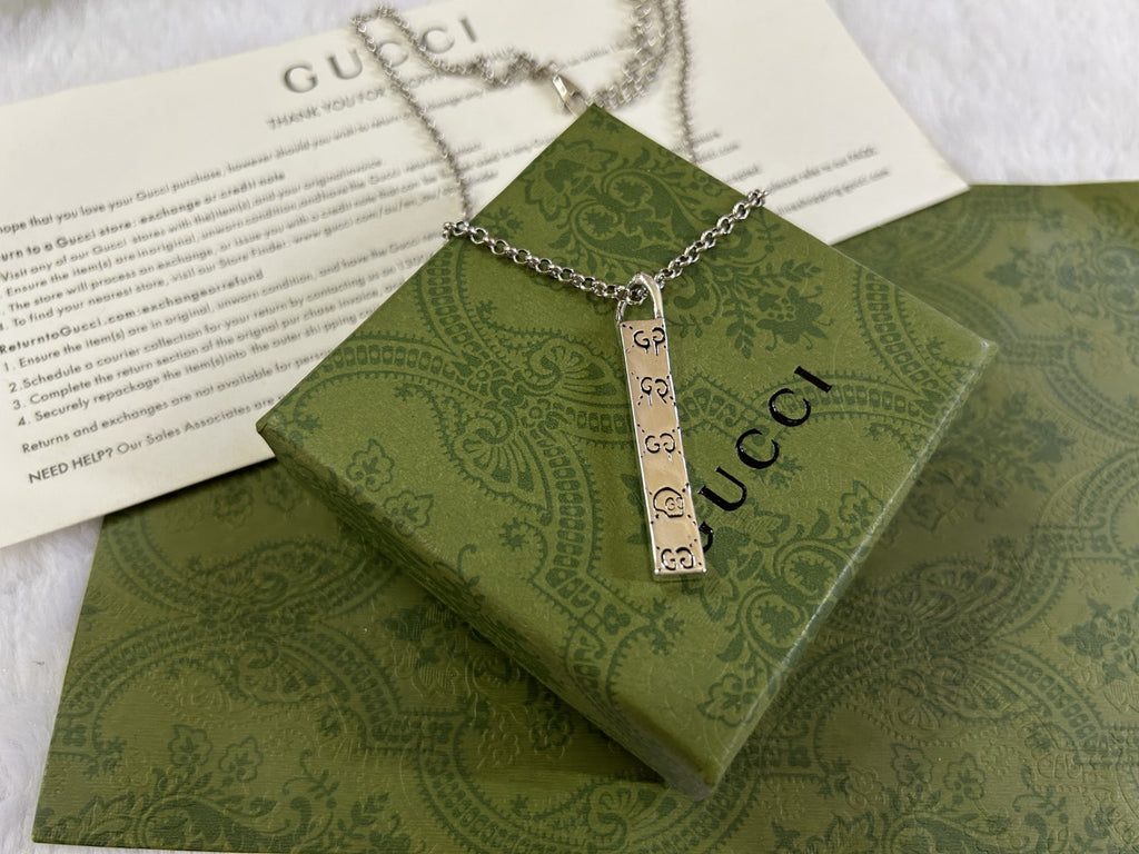 Gucci necklace with silver chain and rectangular GG charm pendant