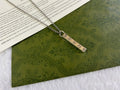 Gucci necklace with silver chain and long rectangular GG charm pendant
