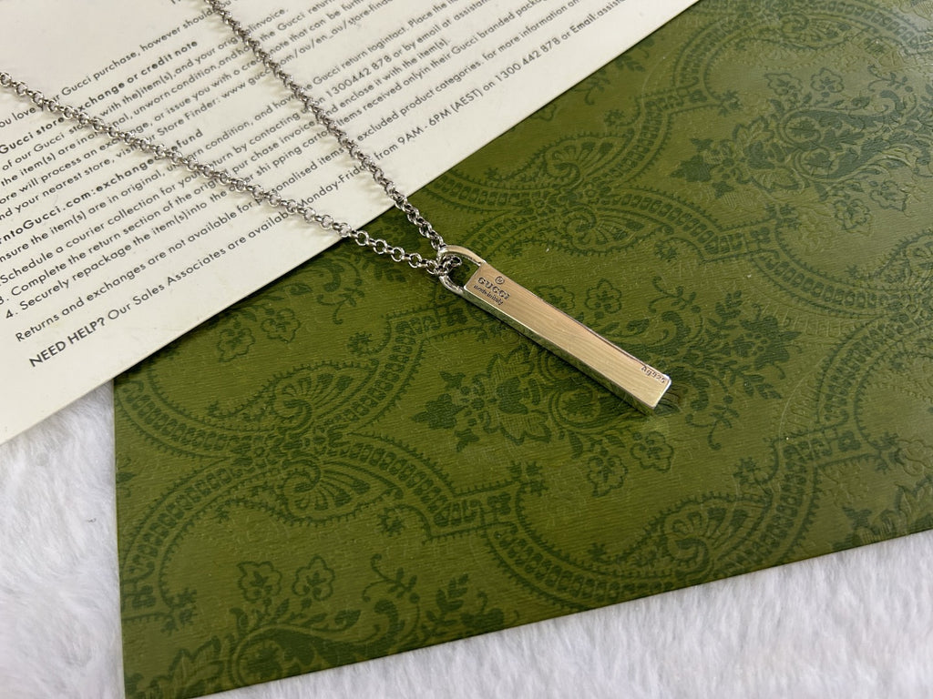 Gucci necklace with silver chain and rectangular GG bar pendant