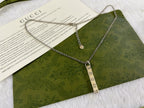 Gucci necklace with silver chain and multiple GG charms with round tag