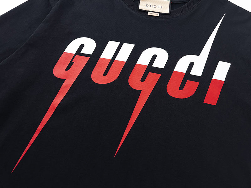 Navy Gucci T-shirt with large 'gucci' logo in red and white