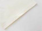 Cream T-shirt sleeve cuff detail with stitched seam