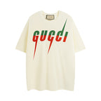 Cream T-shirt with Gucci logo graphic, green lettering and red drips on front