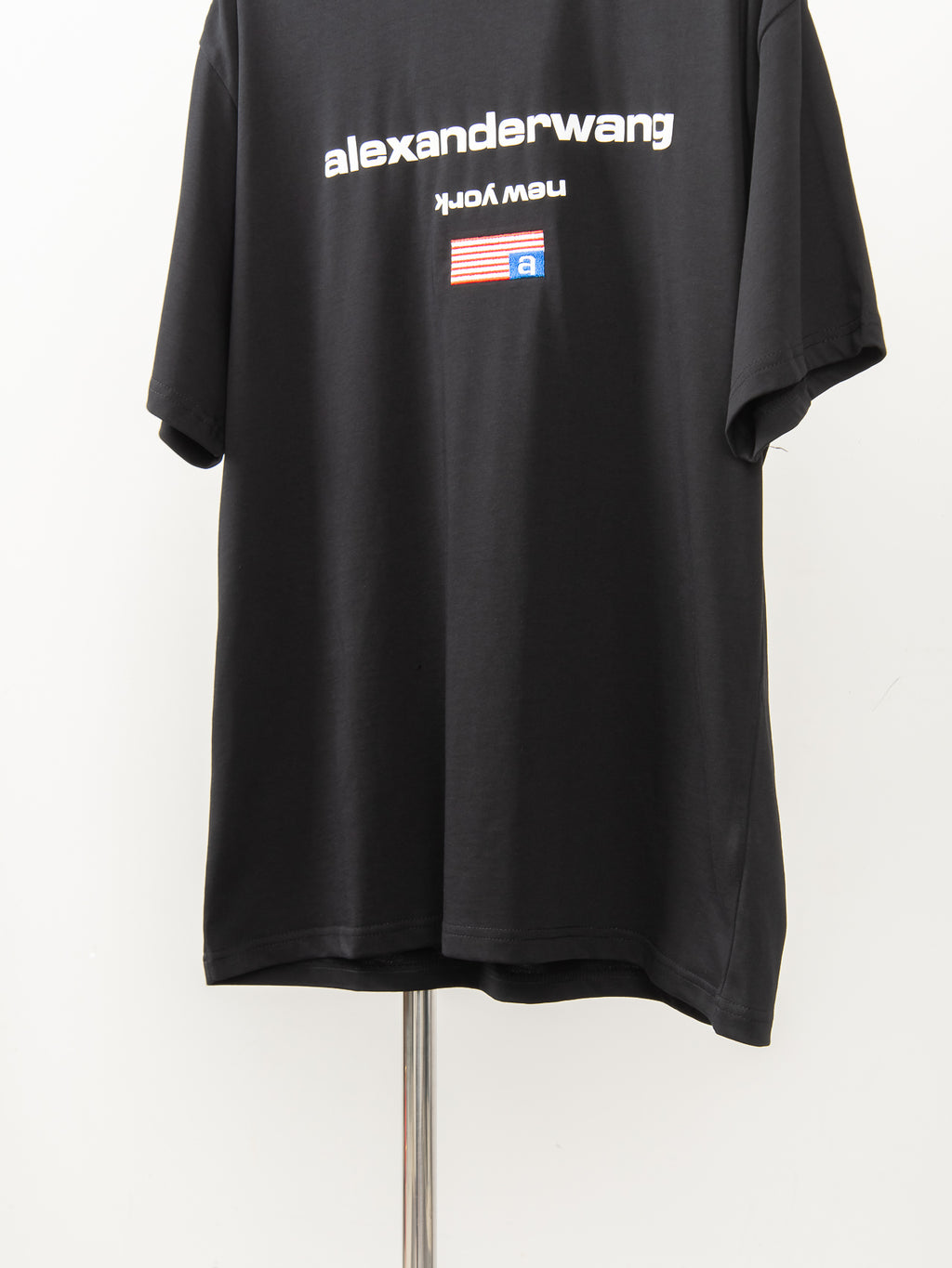 Black short-sleeve T-shirt with alexanderwang logo across the upper back