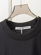 Black crew-neck T-shirt collar with alexanderwang brand label inside neckline
