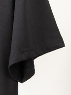 Black T-shirt sleeve hem with neat stitching detail