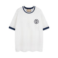 White short-sleeve T-shirt with navy collar and Gucci 1921 logo patch