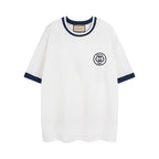 White short-sleeve T-shirt with navy collar and Gucci 1921 logo patch
