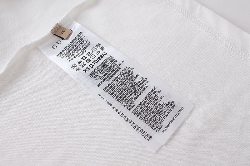 White T-shirt with internal care label tag near side