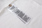 White T-shirt with internal care label tag near side