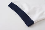 White T-shirt sleeve with navy cuff trim