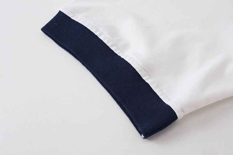 White T-shirt sleeve with navy cuff trim