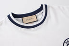 White short-sleeve T-shirt neckline with navy striped collar trim