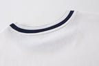 White T-shirt crew neck with navy ribbed trim