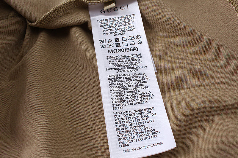 Gucci tan T-shirt care label sewn inside neckline