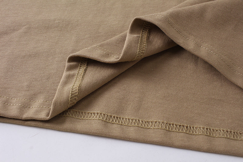 Tan T-shirt fabric with stitched hem and side seam detail