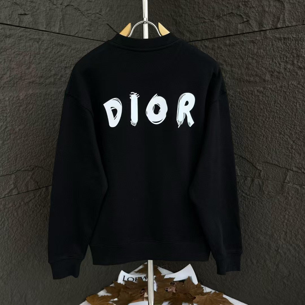 Black crewneck sweatshirt with large white DIOR text on the back.