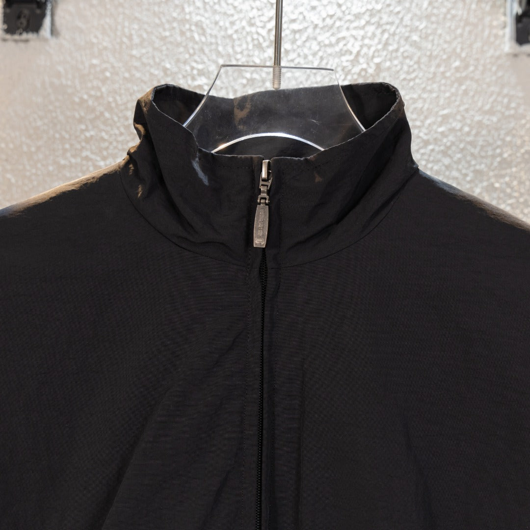 Black Balenciaga long jacket close-up of stand collar and front zipper