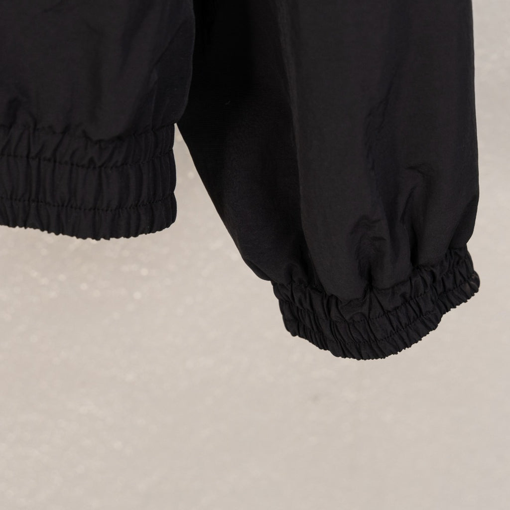Black Balenciaga long jacket hem with elastic waistband and ribbed cuff