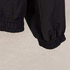 Black Balenciaga long jacket hem with elastic waistband and ribbed cuff
