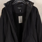 Black Balenciaga long jacket interior view with hood opening and tags