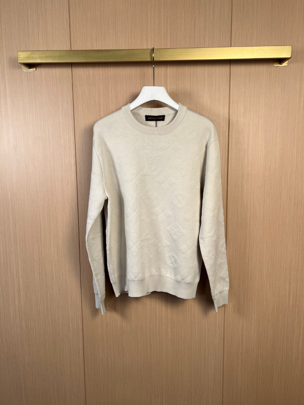 Cream crew-neck long-sleeve sweater with textured knit pattern