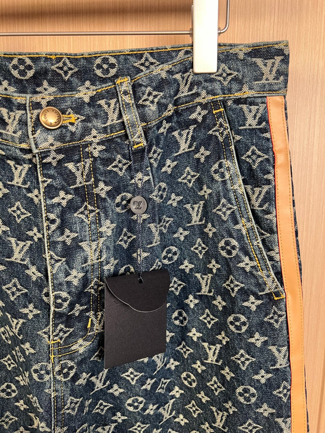 Louis Vuitton monogram denim pants, front button closure with hanging price tag