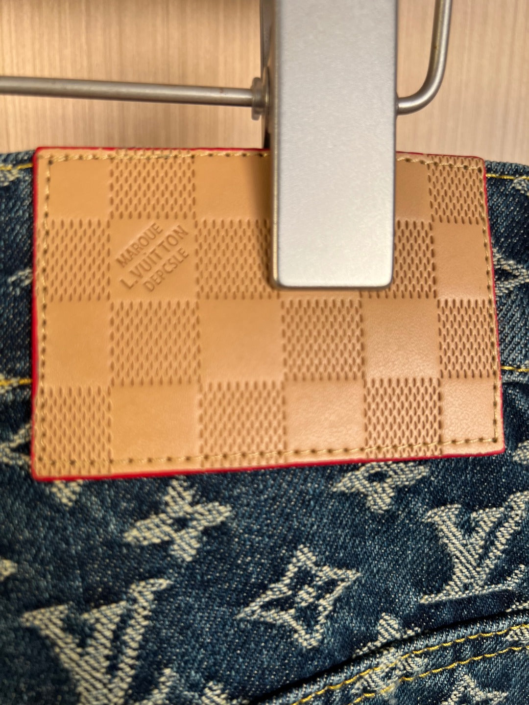 Louis Vuitton monogram denim inner pocket with tan leather-like label