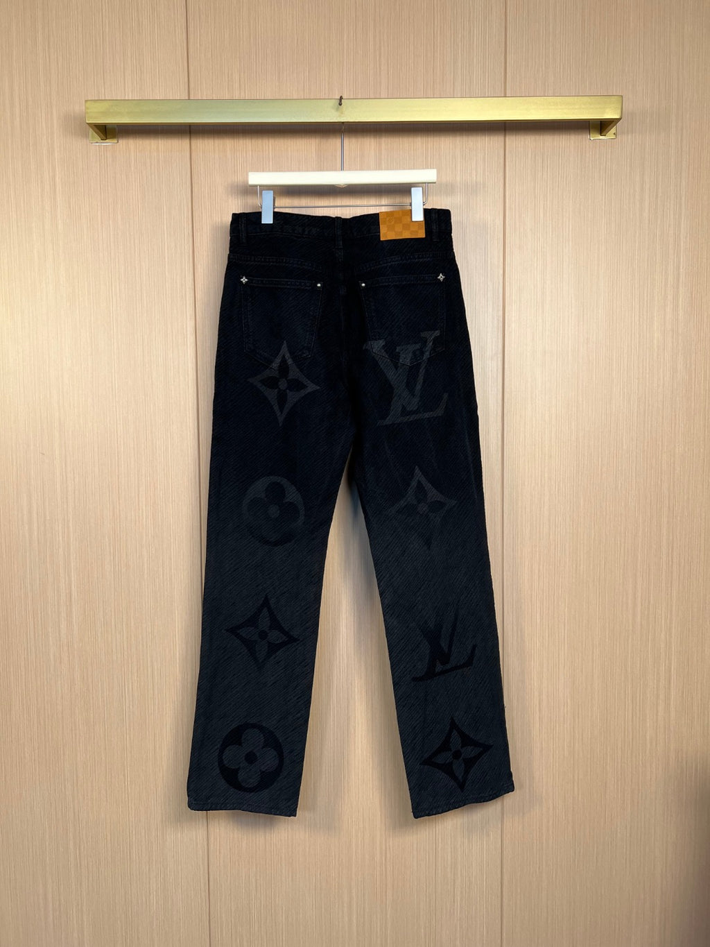 Louis Vuitton monogram pants in dark denim, straight fit, full front view.