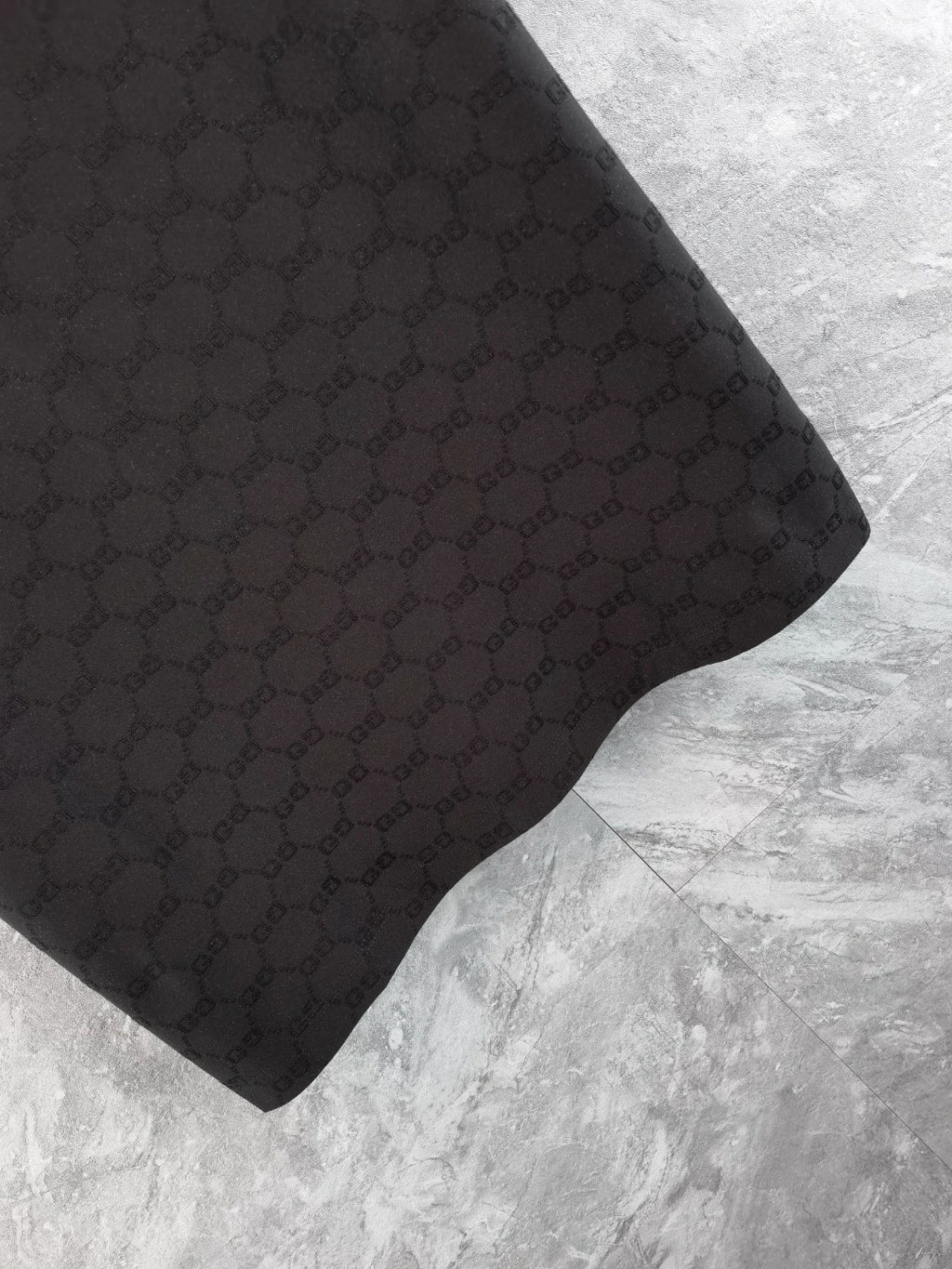 Gucci polo shirt sleeve, black with textured interlocking pattern
