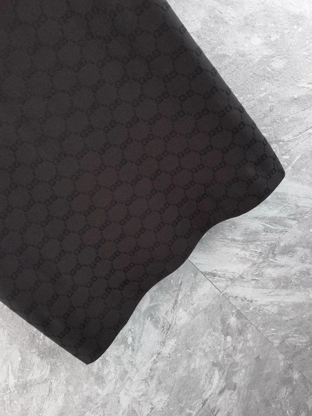 Gucci polo shirt sleeve, black with textured interlocking pattern