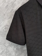 Gucci polo shirt side view, black with textured interlocking pattern