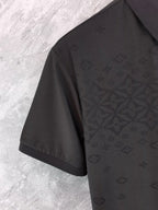Black monogram polo shirt sleeve and side panel detail