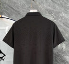Black polo shirt close-up back with short sleeves and textured monogram pattern