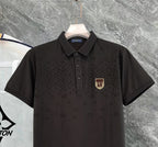 Louis Vuitton black polo shirt, front close-up with button placket and chest crest