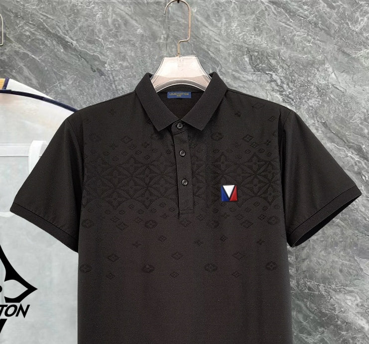 Black polo shirt close-up with collar, button placket, and chest logo patch