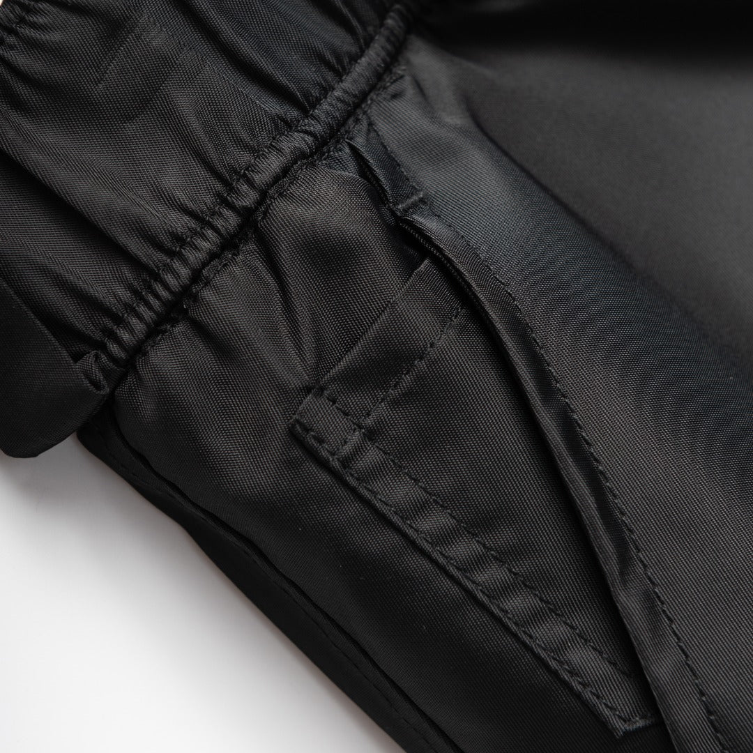Prada black nylon cargo pants pocket seam and stitched panel