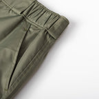 Olive Prada cargo shorts with elastic cuff and stitched panel seams