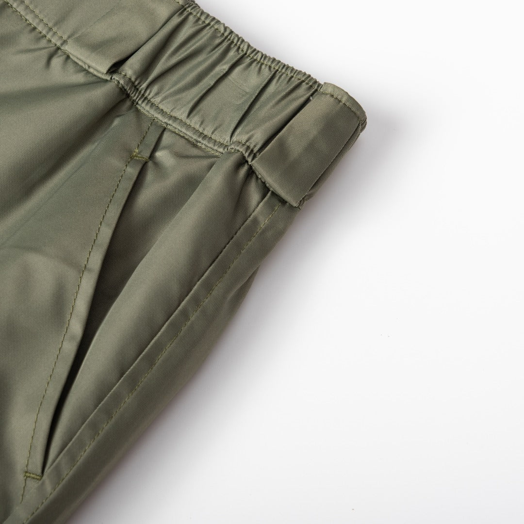 Olive Prada cargo shorts with elastic cuff and stitched panel seams