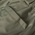 Olive Prada cargo shorts with angled seam and stitched zipper fly
