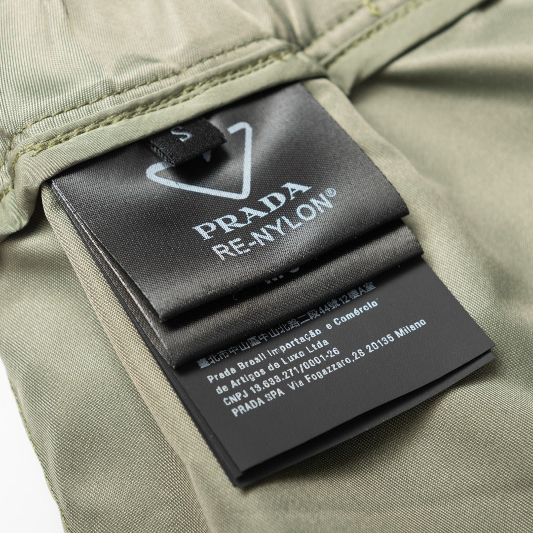 Olive Prada care label and “PRADA RE-NYLON” tag inside waistband