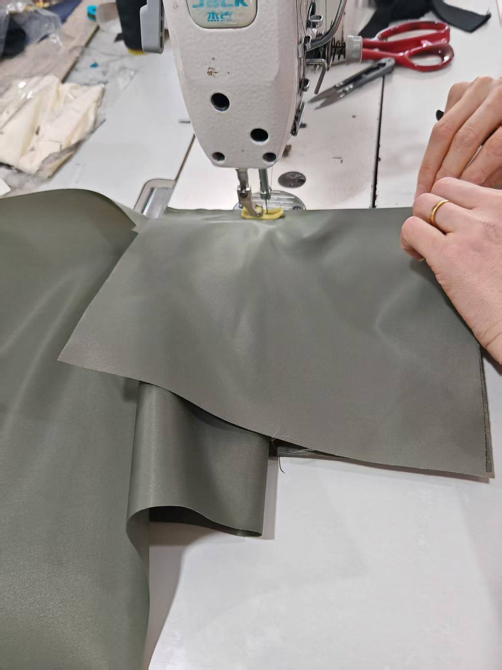 Dark gray pants with side pockets, laid flat