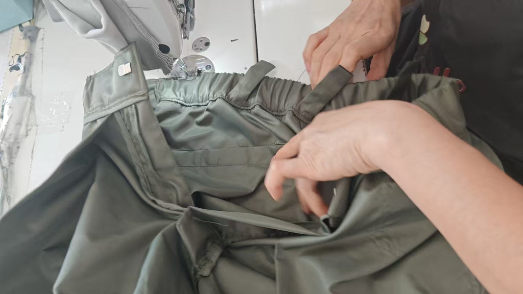 Olive cargo pants with gathered elastic waistband and side pockets