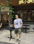 Olive cargo shorts with front pockets and belt loops